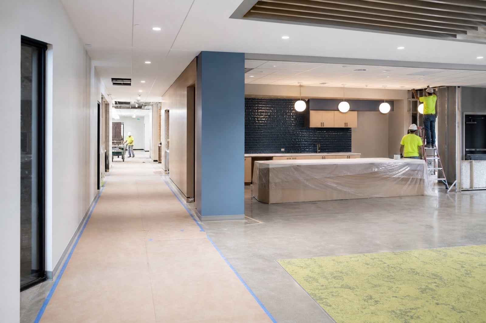 Commercial employee amenity and corridor renovation underway in an occupied building